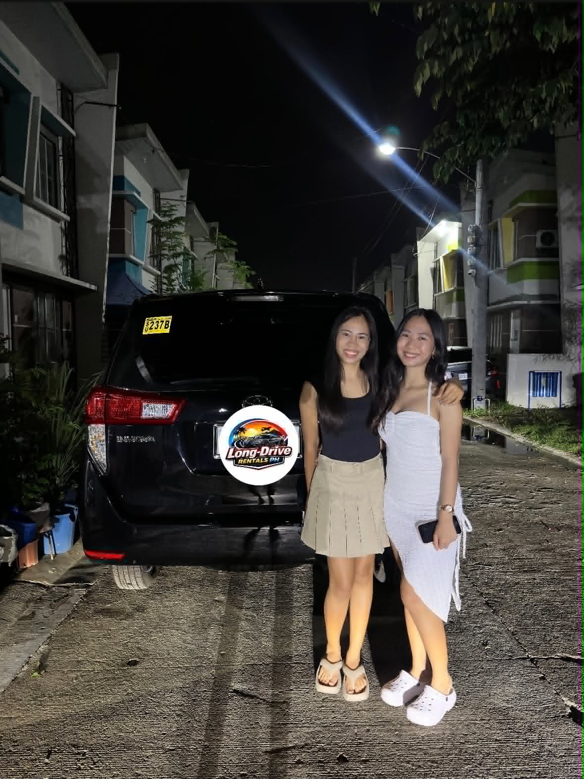 Happy customer with rental vehicle
